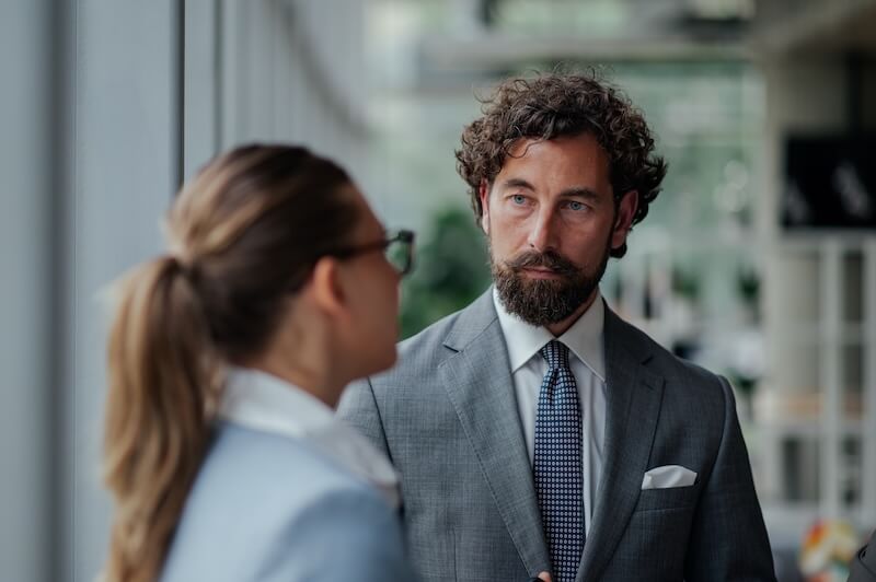 Man asking questions to business owner before buying their business