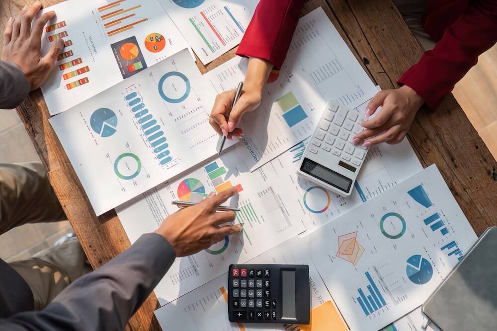 Business Owners and M&A Advisor going over Actual Historical Results to improve Business Valuation before sale