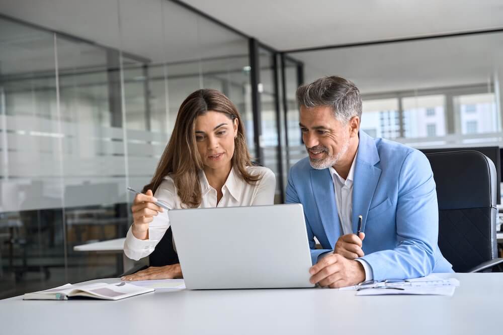 M&A advisor going over a problem and solution with business owner