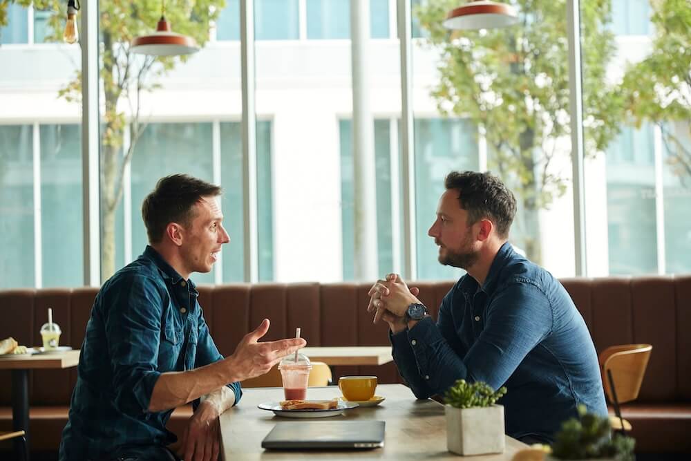 2 men talking about goals for selling business